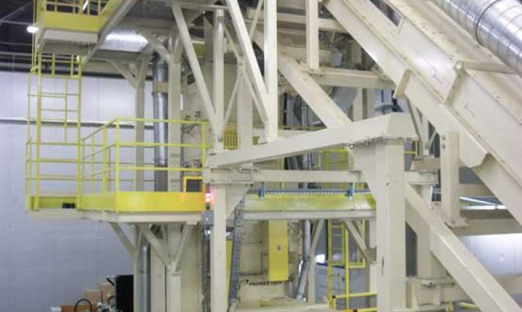 The baler infeed conveyor has a customised incline to accommodate the plant's space constraints. Fitted with additional dedusting ports, it is completely enclosed to prevent fugitive dust.